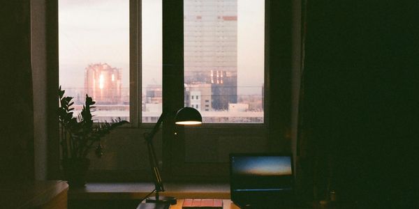 Soft light hitting an office window during sunset.